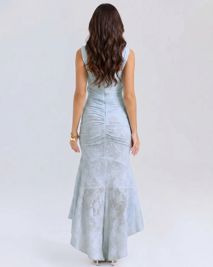 Back view of light blue corset midi dress showing wide straps, back zipper, and ruched seams