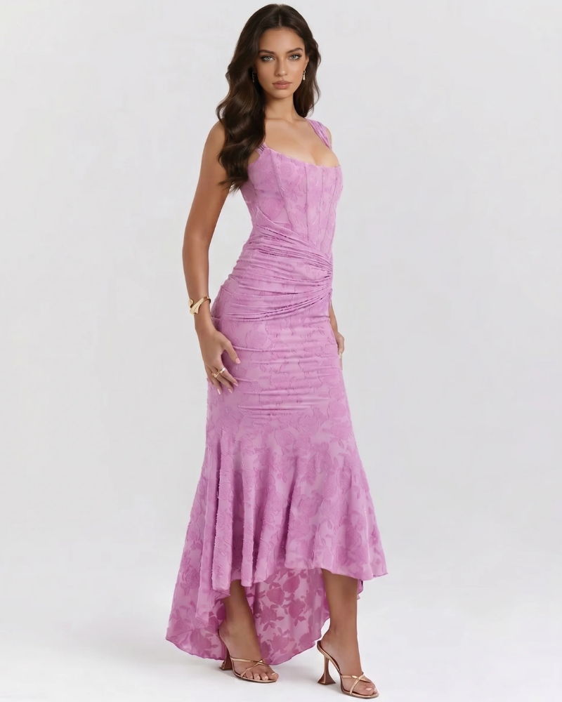 Side view of pink floral corset midi dress featuring gathered ruching at waist and draped high-low skirt