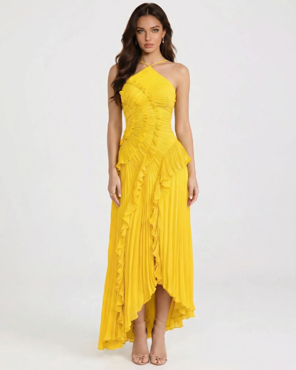 Front view of yellow ruffle maxi dress with halter neckline, ruched bodice and pleated skirt