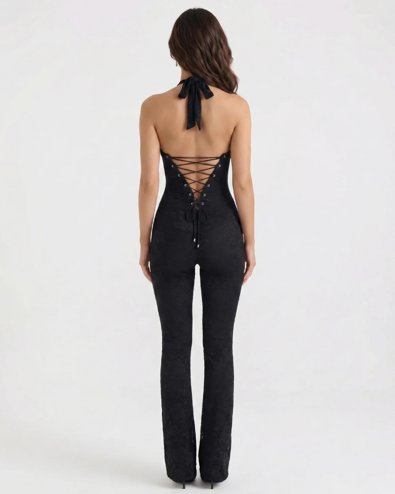 Back view black corset jumpsuit with halter tie neck and lace-up corset back, flared pants