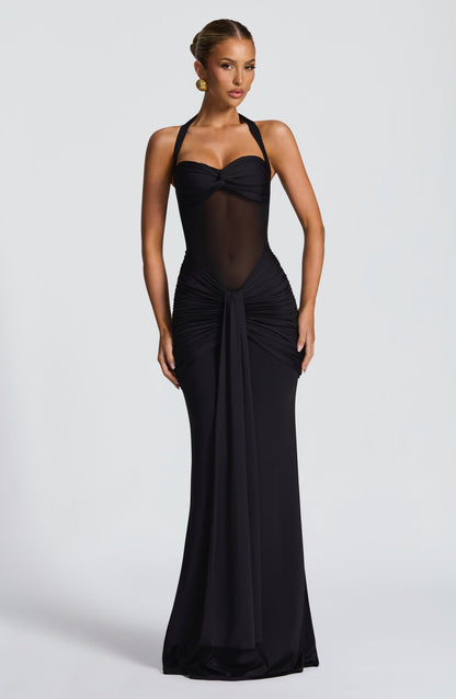 Full-length black Jayleen Ruched Maxi Dress with sheer mesh midriff and halter neckline, front view.