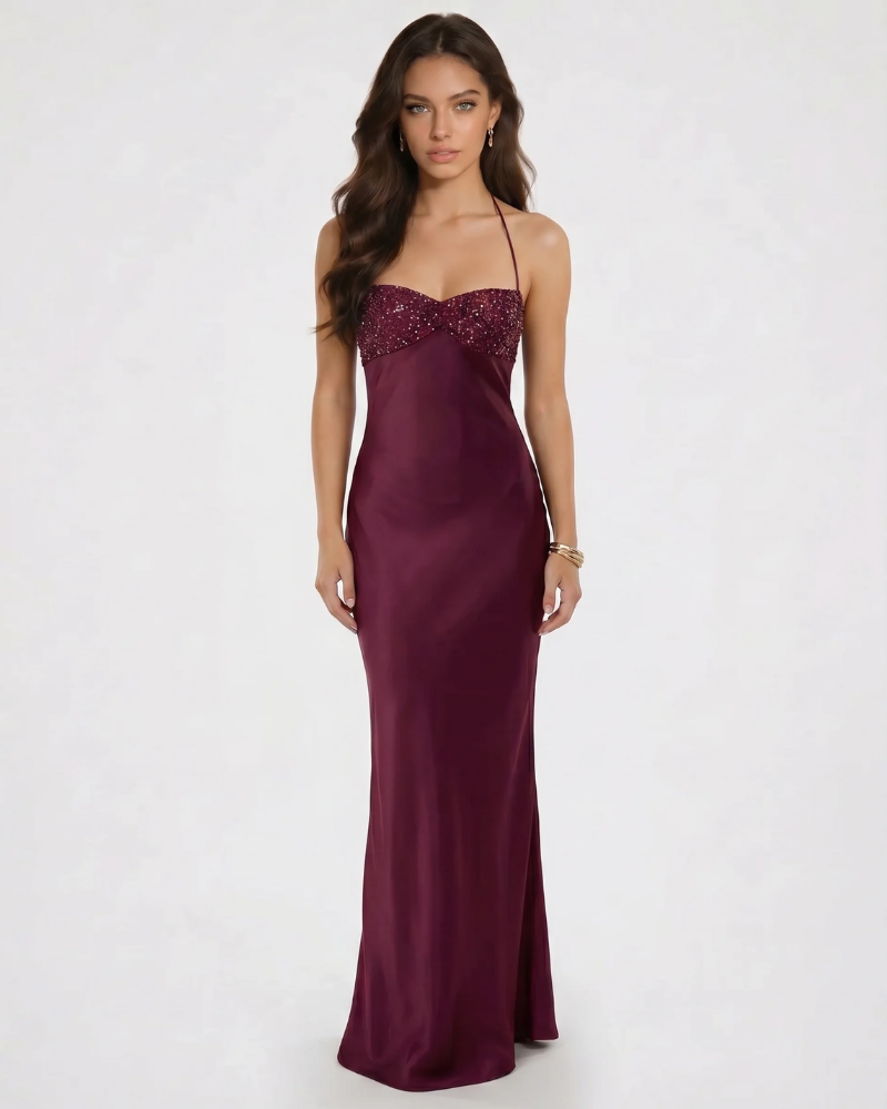 Burgundy sequin sweetheart bodice maxi dress with halter straps and sleek satin skirt, front view