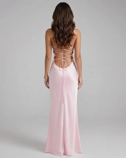 Back view of pink maxi dress with open back and crisscross lace-up straps, floor length