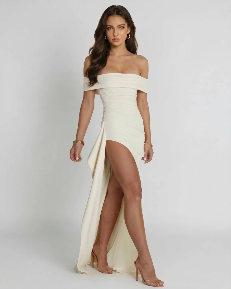 Side angle of white ruched off-shoulder maxi dress showing draped skirt panel and high slit