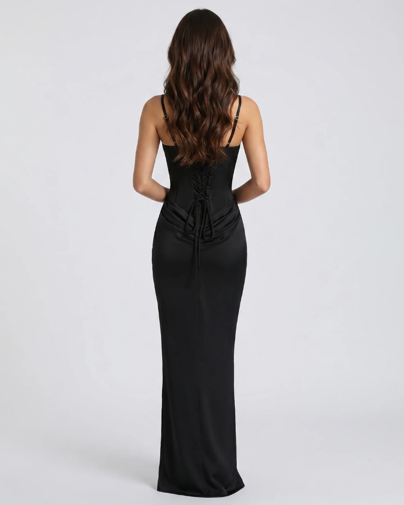 Back view of black draped maxi dress with lace-up corset back, slim straps and floor-length skirt