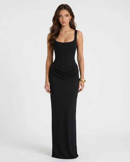 Black draped maxi dress with square neckline, wide straps, fitted corset bodice and ruched hip detail