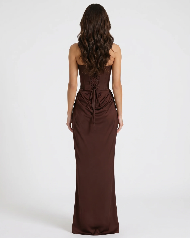 Back view of brown maxi dress with lace-up corset detail and long skirt hem