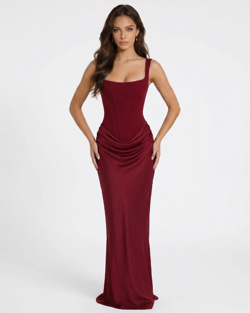 Burgundy draped maxi dress with square neckline, corset seams, and ruched hip detail