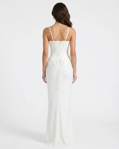 Back view of white maxi dress with lace-up corset back and adjustable straps, floor-length hem