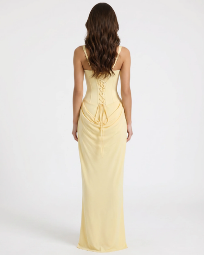 Back view yellow maxi dress with lace-up corset back, wide straps, and draped waist detail