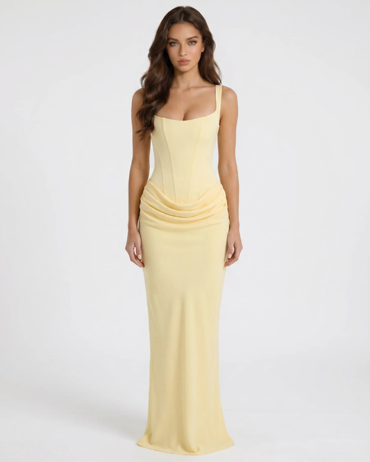 Yellow draped maxi dress with square neckline, corset-style seams, and fitted skirt