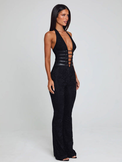 Side view of the black Kenzie halter jumpsuit, highlighting the deep V-neck, detailed corset lacing, and the elegant silhouette.