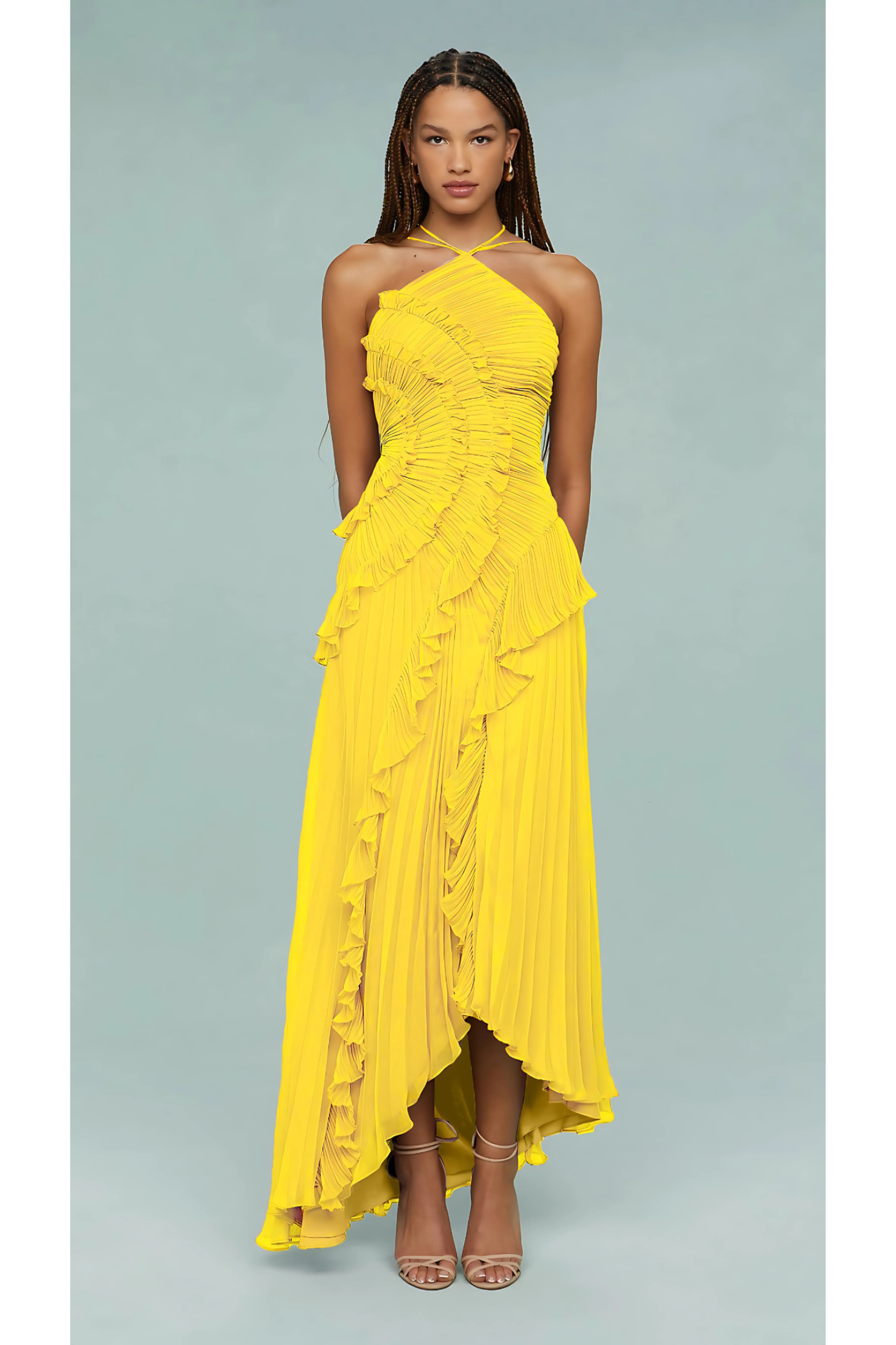 Full length front view of a vibrant yellow Millie Ruffle Midi Dress, showcasing the pleated fabric and asymmetric hem.