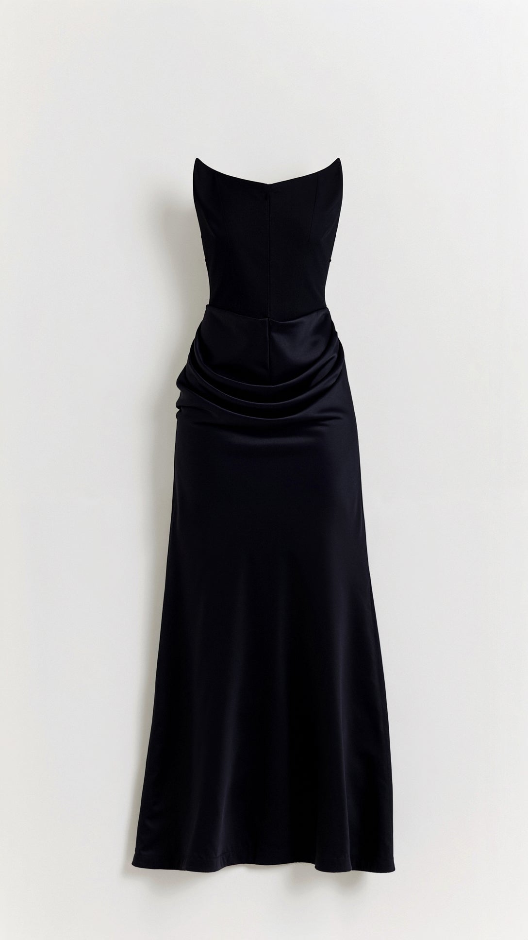 Black strapless maxi dress with a structured bodice and elegant draped waist detail, flowing into a sleek skirt.