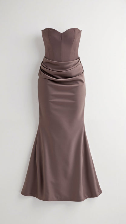 Mocha brown strapless maxi dress featuring a structured corset-style bodice and a beautifully draped, ruched waistline.