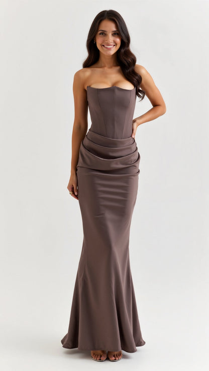 Brown Samira Draped Maxi Dress, strapless with a structured corset top and a gracefully draped waistline leading to a long skirt.