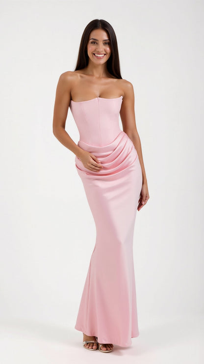 Light pink Samira Draped Maxi Dress, strapless with a fitted corset bodice and a soft, draped skirt detail, ideal for special occasions.