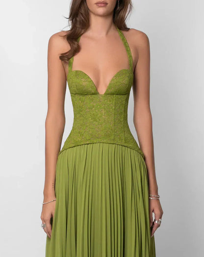 Close-up of green lace bodice with sweetheart neckline and halter straps on a maxi dress for women.